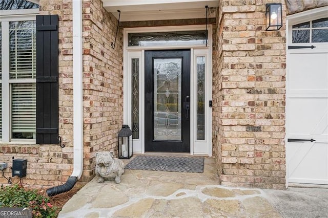 1525 Camden Cove Dr, Cumming, GA 30040 - doorway to property featuring brick siding and a garage