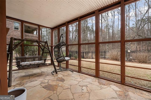 1525 Camden Cove Dr, Cumming, GA 30040 - unfurnished sunroom featuring stone floors, a wall of windows, and healthy amount of natural light