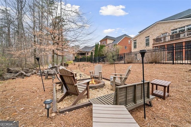 1525 Camden Cove Dr, Cumming, GA 30040 - view of property's community featuring a fire pit, fence, and a residential view