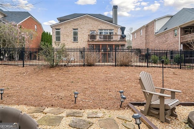 1525 Camden Cove Dr, Cumming, GA 30040 - back of property featuring fence, a chimney, a balcony, and brick siding