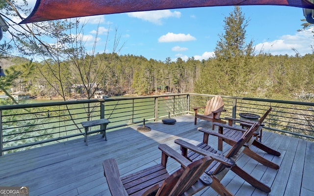 deck featuring a view of trees