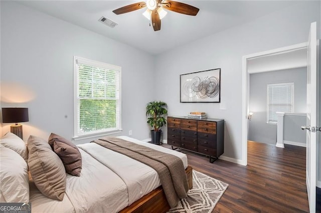 3826 Baxley Village Trl, Suwanee, GA 30024 - bedroom with dark wood-style floors, baseboards, and a ceiling fan