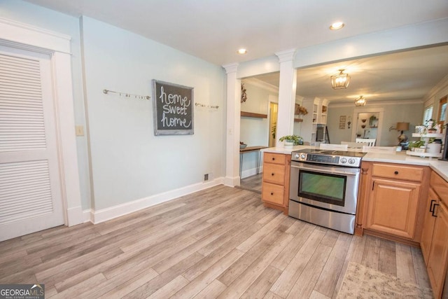 kitchen featuring stainless steel electric range oven, light countertops, light wood-style floors, recessed lighting, and baseboards