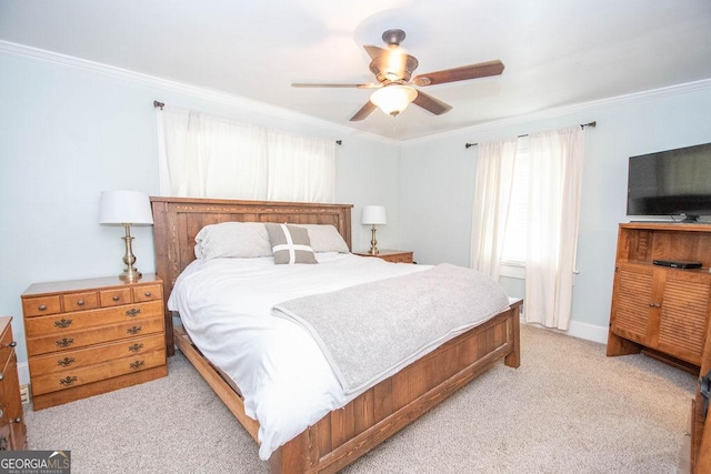 bedroom featuring ornamental molding, light colored carpet, and ceiling fan