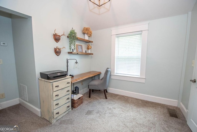 carpeted home office with baseboards