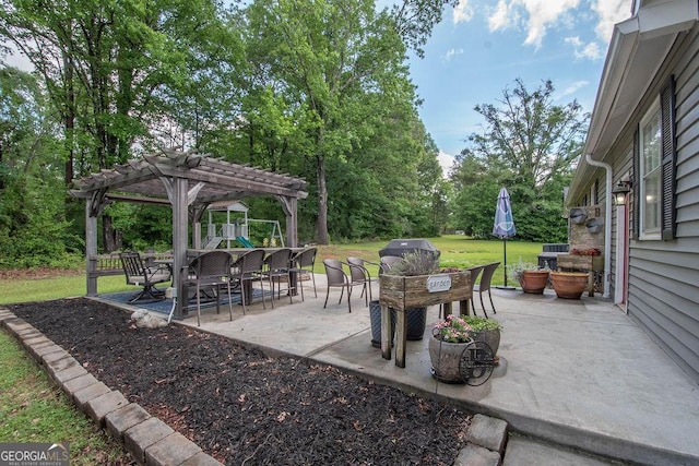 view of patio / terrace with a pergola, view of scattered trees, and outdoor dining area