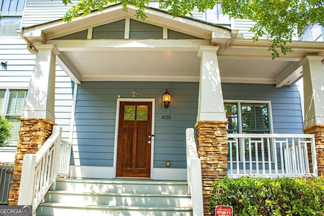 doorway to property featuring a porch