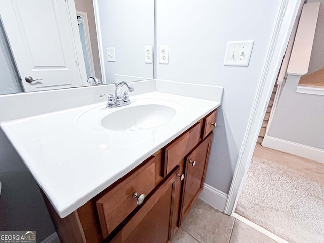 bathroom with vanity and baseboards