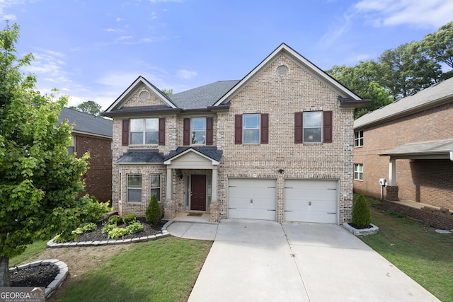 1181 Gateview Dr, Lawrenceville, GA 30046 - view of front of property featuring brick siding, driveway, a garage, and a front yard