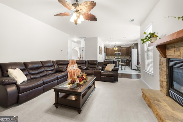 1181 Gateview Dr, Lawrenceville, GA 30046 - living area with a ceiling fan, light colored carpet, and a fireplace