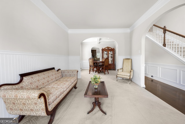 1181 Gateview Dr, Lawrenceville, GA 30046 - living room with crown molding, a wainscoted wall, arched walkways, and stairway