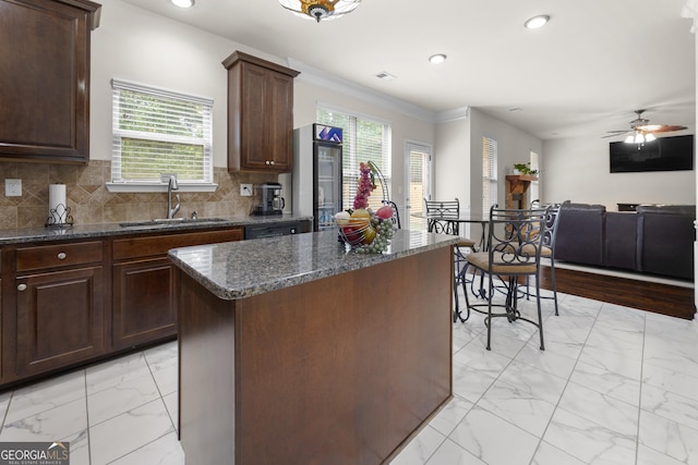 1181 Gateview Dr, Lawrenceville, GA 30046 - kitchen with a sink, light marble finish flooring, plenty of natural light, a center island, and recessed lighting