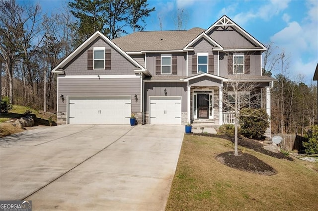 541 Glen Abbey Cir, Mableton, GA 30126 - craftsman-style house featuring stone siding, an attached garage, concrete driveway, and a front lawn