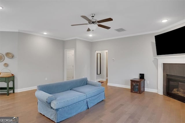 541 Glen Abbey Cir, Mableton, GA 30126 - living room with a ceiling fan, wood finished floors, recessed lighting, ornamental molding, and a tile fireplace