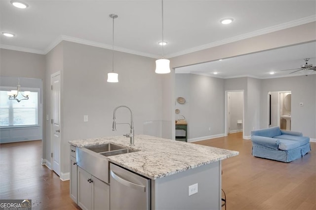 541 Glen Abbey Cir, Mableton, GA 30126 - kitchen featuring dishwasher, a sink, baseboards, light wood-style flooring, and a center island with sink