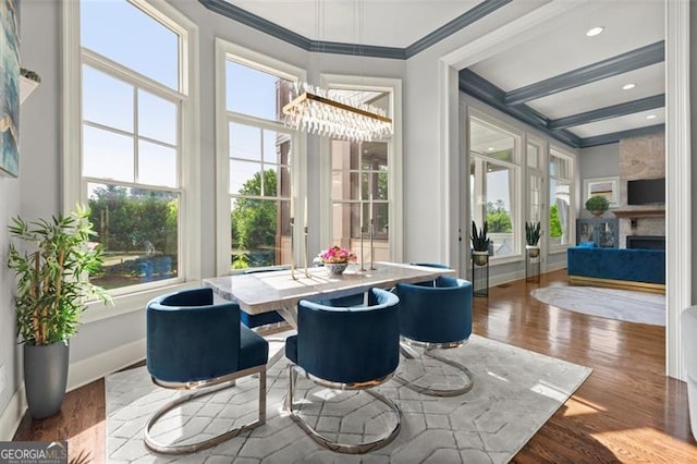 15815 Winterfield Way, Alpharetta, GA 30004 - dining area featuring a chandelier, healthy amount of natural light, crown molding, wood finished floors, and beam ceiling