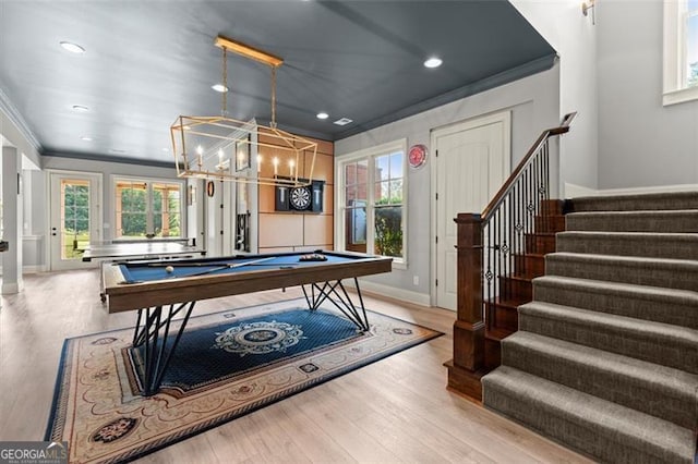 recreation room with ornamental molding, baseboards, plenty of natural light, billiards table, and wood finished floors