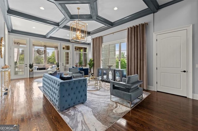 living area featuring french doors, wood-type flooring, a chandelier, coffered ceiling, and beam ceiling