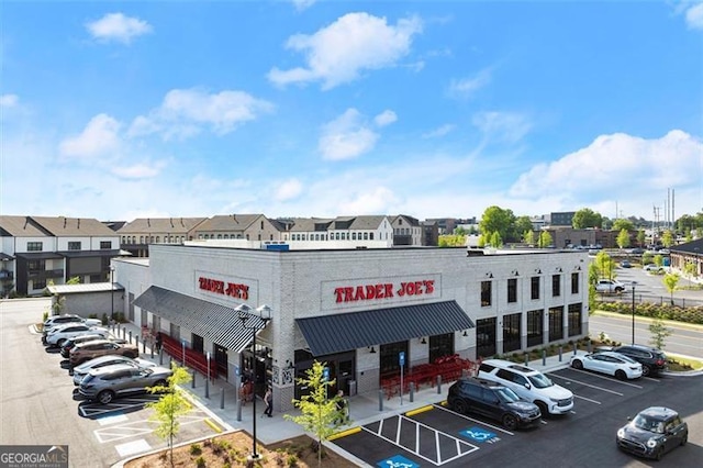 view of commercial property with uncovered parking