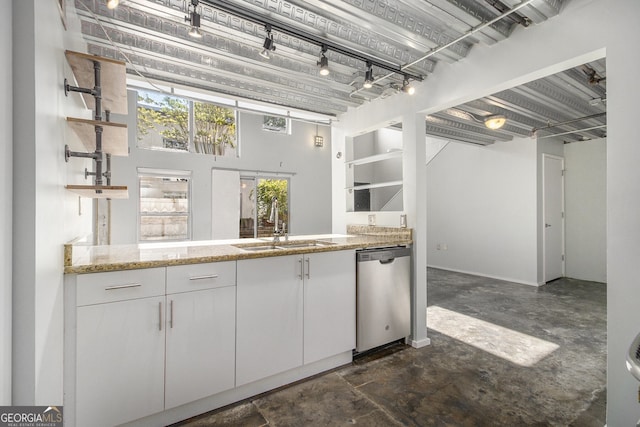 195 Arizona Ave Unit 179, Atlanta, GA 30307 - kitchen featuring stainless steel dishwasher, open shelves, light stone countertops, and a sink