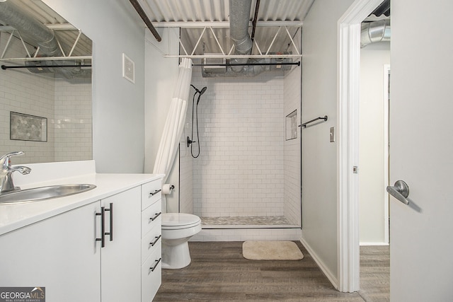 195 Arizona Ave Unit 179, Atlanta, GA 30307 - bathroom featuring a shower stall, wood finished floors, toilet, and vanity