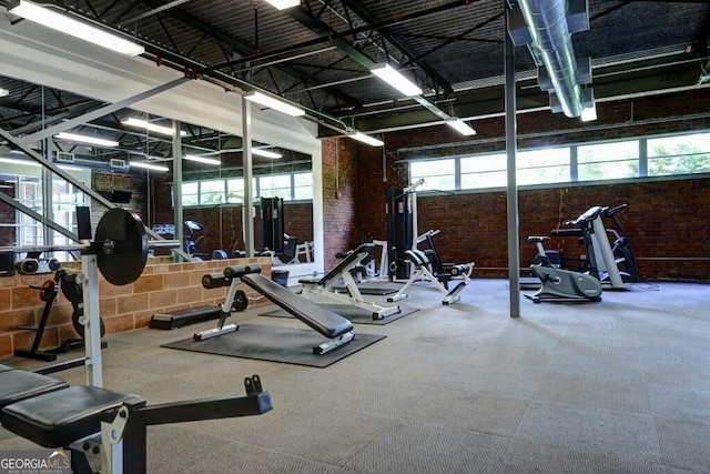 195 Arizona Ave Unit 179, Atlanta, GA 30307 - exercise room with brick wall and a towering ceiling