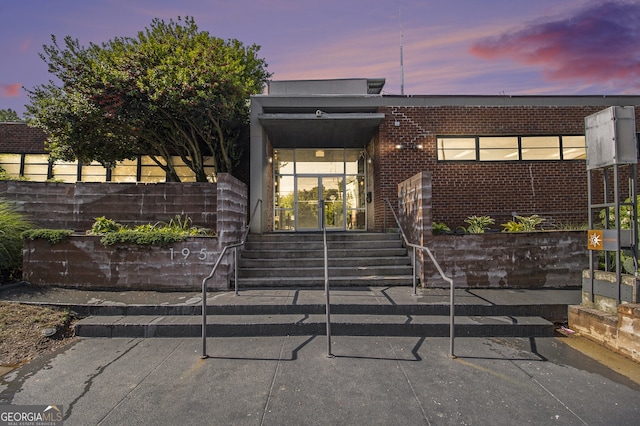 195 Arizona Ave Unit 179, Atlanta, GA 30307 - exterior entry at dusk with brick siding