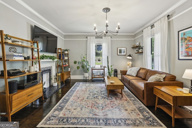 1211 Mortimer Pl SE, Atlanta, GA 30317 - living room featuring wood-type flooring, a chandelier, ornamental molding, a fireplace, and baseboards