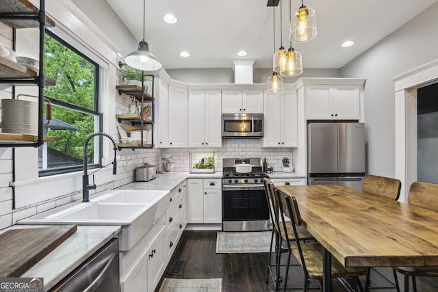 1211 Mortimer Pl SE, Atlanta, GA 30317 - kitchen featuring appliances with stainless steel finishes, dark wood-style floors, white cabinets, a sink, and recessed lighting