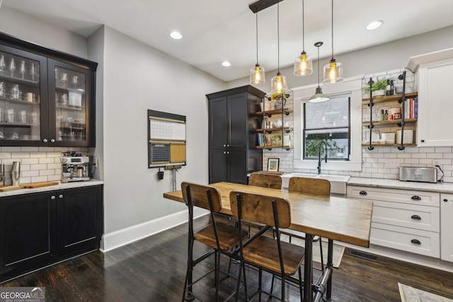 1211 Mortimer Pl SE, Atlanta, GA 30317 - dining area with dark wood finished floors, baseboards, and recessed lighting