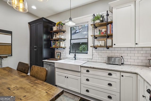 1211 Mortimer Pl SE, Atlanta, GA 30317 - kitchen featuring stainless steel dishwasher, open shelves, backsplash, a sink, and butcher block counters