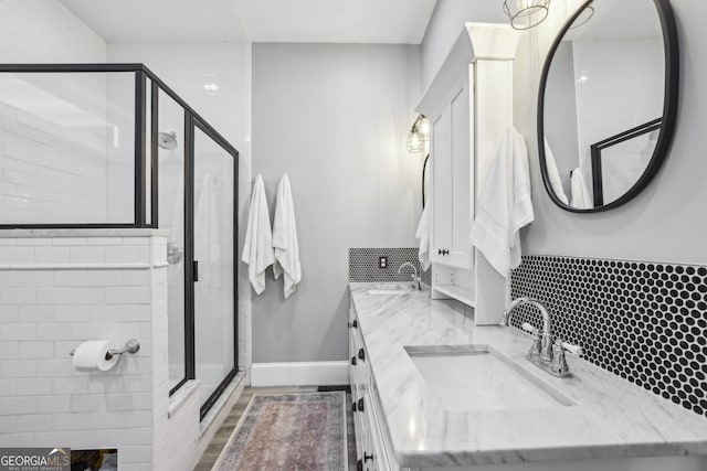 1211 Mortimer Pl SE, Atlanta, GA 30317 - bathroom featuring a stall shower, double vanity, and baseboards