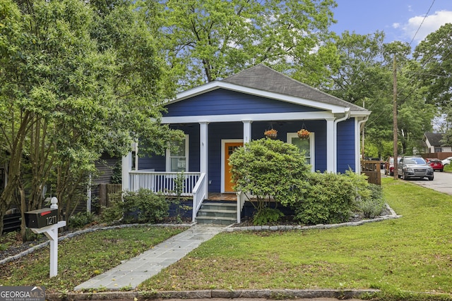 1211 Mortimer Pl SE, Atlanta, GA 30317 - view of front of home featuring a porch and a front yard