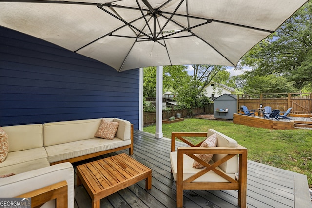 1211 Mortimer Pl SE, Atlanta, GA 30317 - wooden deck featuring outdoor lounge area, a storage shed, and an outbuilding