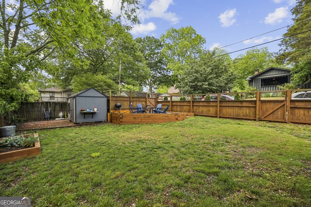 1211 Mortimer Pl SE, Atlanta, GA 30317 - view of yard featuring a vegetable garden, a shed, and an outdoor structure