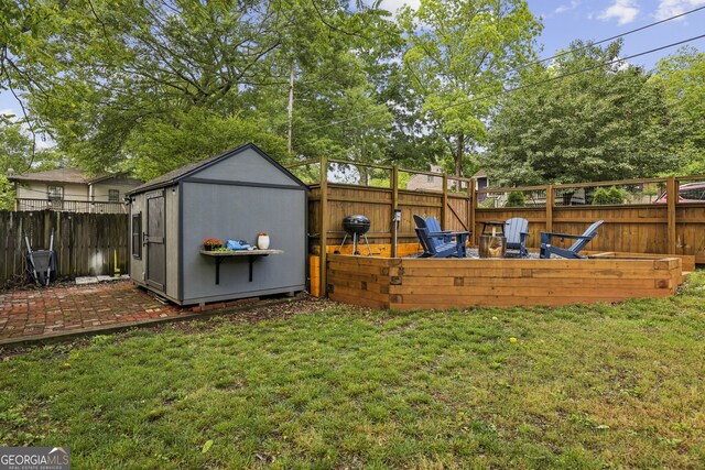 1211 Mortimer Pl SE, Atlanta, GA 30317 - view of yard featuring a shed, an outdoor structure, and a wooden deck
