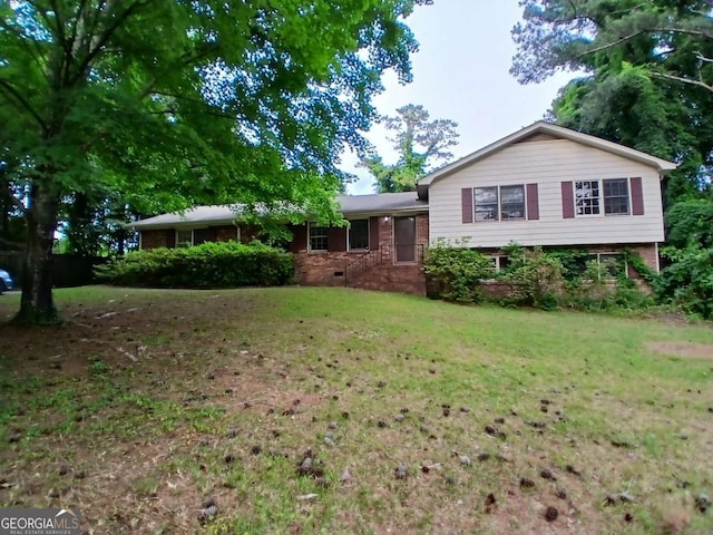 3026 Hidden Forest Dr, Snellville, GA 30078 - split level home with a front lawn and brick siding