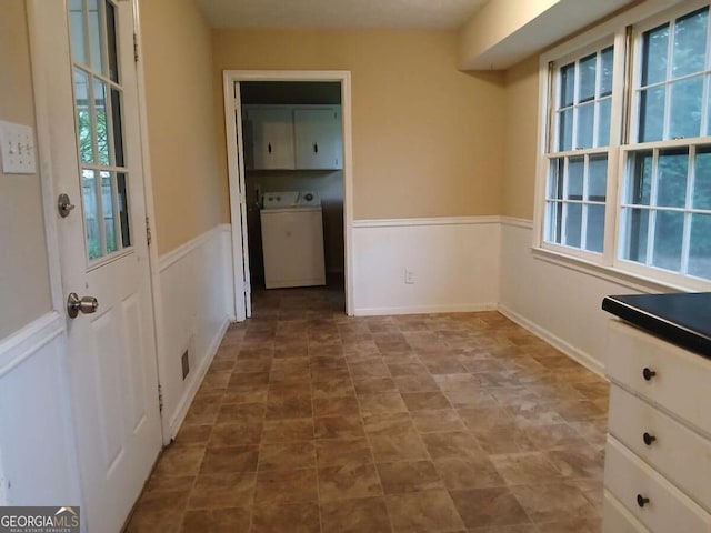 3026 Hidden Forest Dr, Snellville, GA 30078 - unfurnished dining area featuring washer / clothes dryer and a wainscoted wall