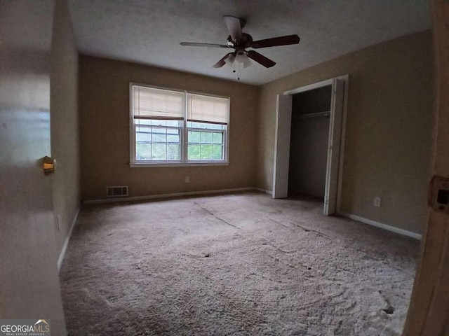 3026 Hidden Forest Dr, Snellville, GA 30078 - unfurnished bedroom featuring carpet, baseboards, a ceiling fan, and a closet
