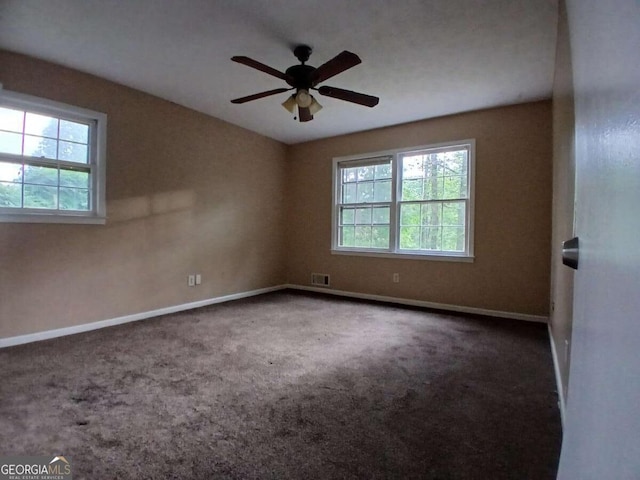 3026 Hidden Forest Dr, Snellville, GA 30078 - unfurnished room featuring healthy amount of natural light, baseboards, carpet floors, and ceiling fan