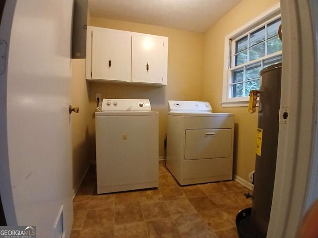 3026 Hidden Forest Dr, Snellville, GA 30078 - laundry area featuring cabinet space, separate washer and dryer, water heater, and baseboards