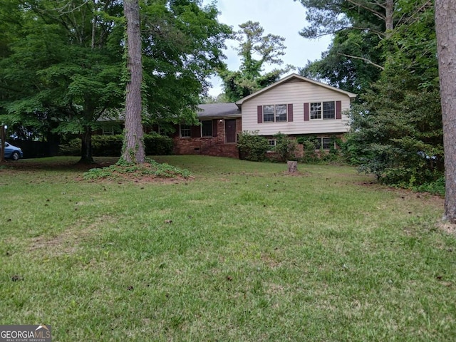 3026 Hidden Forest Dr, Snellville, GA 30078 - tri-level home featuring brick siding and a front lawn