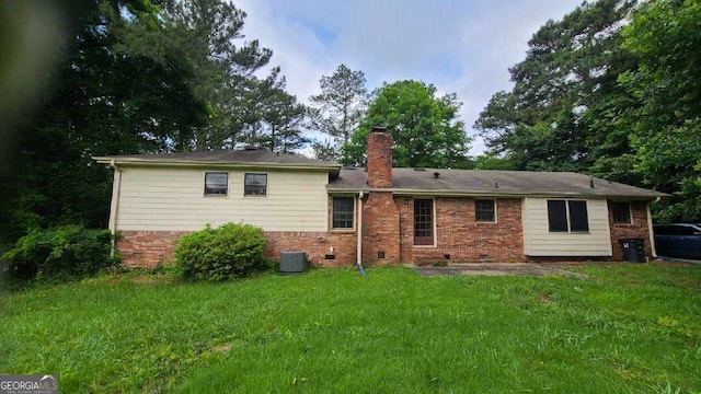3026 Hidden Forest Dr, Snellville, GA 30078 - back of property with brick siding, a chimney, a lawn, and crawl space