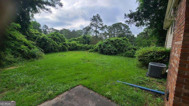 3026 Hidden Forest Dr, Snellville, GA 30078 - view of grassy yard with central AC