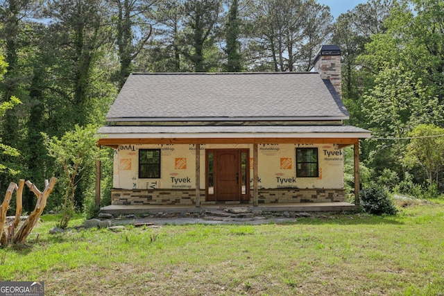 2003 Greeson Rd, Dacula, GA 30019 - property in mid-construction with a shingled roof, a porch, a chimney, and a front yard