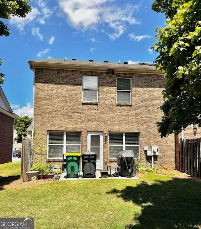 back of house with brick siding