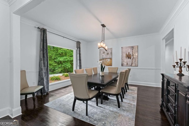 dining space with a chandelier, dark wood-style flooring, ornamental molding, and baseboards