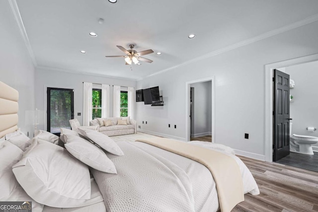 bedroom with crown molding, recessed lighting, wood finished floors, baseboards, and ensuite bath