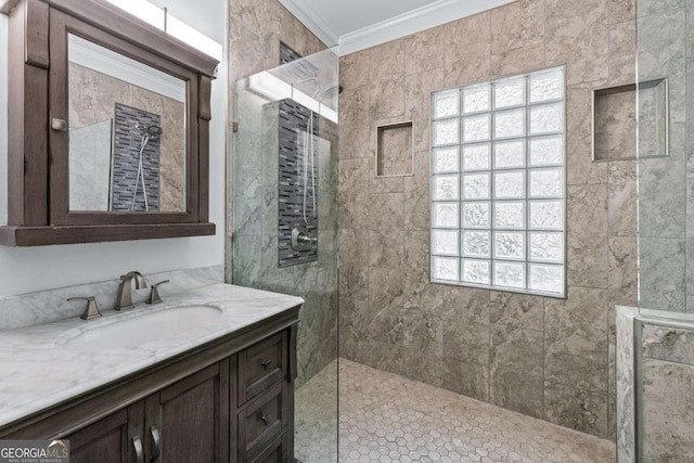 full bathroom with ornamental molding, a walk in shower, vanity, and plenty of natural light