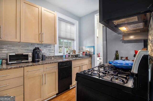 61 16th St NE Unit 4, Atlanta, GA 30309 - kitchen with black dishwasher, gas range, tasteful backsplash, light brown cabinets, and range hood